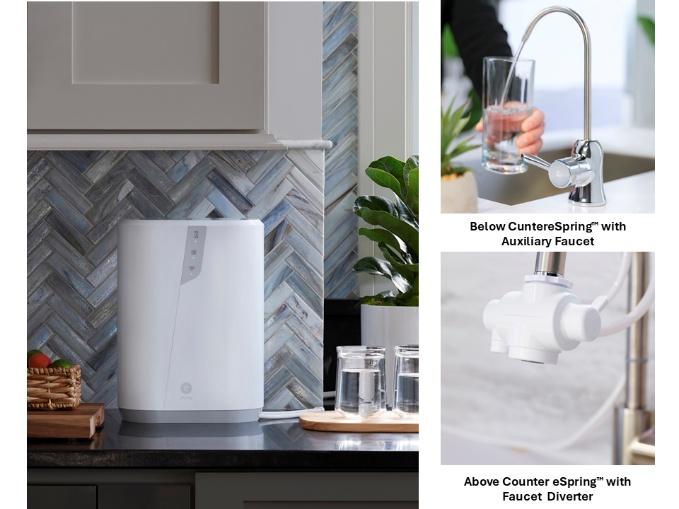 Modern white water purifier and dispenser on kitchen counter with glass of water.